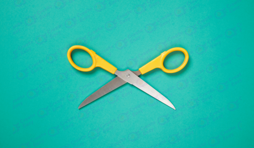 Scissors on colored background